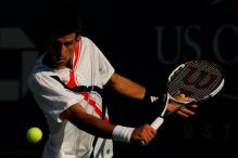 novak djokovic slice backhand near contact.jpg