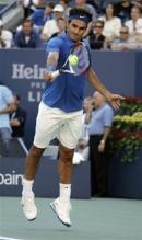 roger federer backhand at contact feet off the ground.jpg