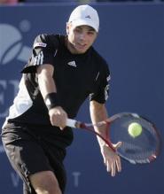 stanislas wawrinka backhand at contact.jpg