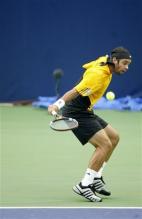 fernando gonzalez backhand slice follow through.jpg