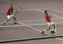 julian knowle defensive two handed volley at contact.jpg