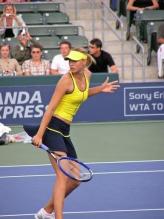 Maria Sharapova looking bach after hitting the backhand slice.jpg