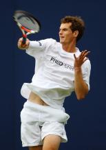Andy Murray hammers a forehand in a Fred Perry shirt.jpg