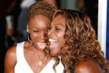 Venus Williams and Serena Williams laughing together.jpg
