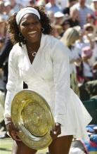 Serena Williams laughs holding her championship plate for Wimbledon 2009.jpg