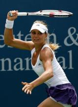 Maria Kirilenko hits a running forehand.JPG
