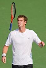 Andy Murray flips his Head Youtek racket in the air.JPG