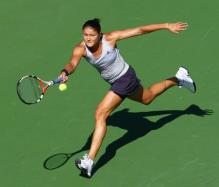 Safina hits a running forehand slice defensive shot.JPG