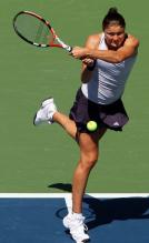 Safina strikes her two handed forehand.JPG