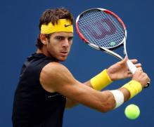 Juan Martin Del Potro goes for a backhand dropshot.JPG