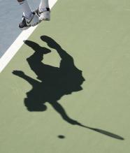 Juan Martin Del Potro's feet in the air on serve and shadow.JPG