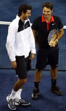 Juan Martin Del Potro and Roger Federer have a laugh.JPG