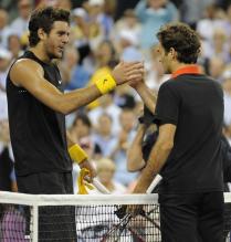 Juan Martin Del Potro is congratulated by Roger Federer.JPG