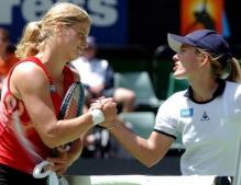 Kim Clijsters shakes hands with Justine Henin back in 2002.JPG