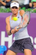Maria Kirilenko hits a two handed backhand in the Korean Open 2009.JPG