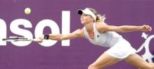 Maria Kirilenko hits a defensive forehand on the run.JPG