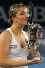 Timea Bacsinszky kisses her Luxembourg Open trophy 2009.JPG