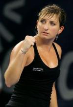 Timea Bacsinszky pumps her fist in a black tennis dress.JPG