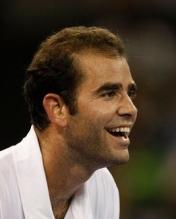 Pete Sampras laughs during a point vs Agassi in 2009.JPG