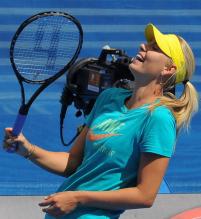 Maria Sharapova laughs during practice.JPG