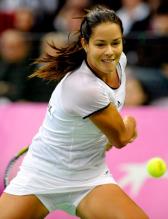Ana Ivanovic racket back to hit the 2 handed backhand during Fed Cup 2010.JPG