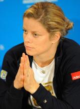 Kim Clijsters in a black jacket listens to a question after her loss at the 2010 Australian Open.JPG