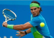Rafael Nadal looks to hit a one handed backhand slice.JPG