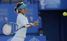 Li Na looks to hit a driving forehand with her Babolot racket.JPG