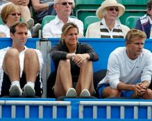 Amelie Mauresmo watches Michael Llodra play.JPG