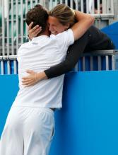 Amelie Mauresmo who is Michael Llodra's coach embraces him after he wins the AEGON International.JPG