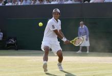 Lu Yen-Hsun steps into a two handed backhand at Wimbledon 2010.JPG