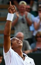 Yen-Hsun Lu point to the sky after a defeating Andy Roddick in 5 sets at Wimbledon.JPG