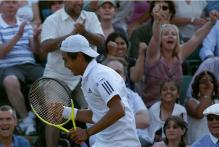 The crowd celebrates as Yen Hsun Lu defeats Andy Roddick during Wimbledon 2010.JPG