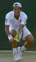 Lu Yen-Hsun hits a low two handed backhand during Wimbledon 2010.JPG