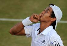 Yen-Hsun Lu looks to the sky after a huge win over Andy Roddick in 5 sets at Wimbledon.JPG