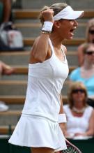 Anna Kournikova celebrates a point during her Wimbledon 2010 doubles match.JPG