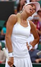Anna Kournikova sticks out her tongue during Wimbledon 2010.JPG