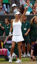Anna Kournikova waves during Wimbledon 2010.JPG