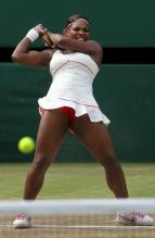 Serena Williams follows through on a 2 handed backhand at Wimbledon.JPG