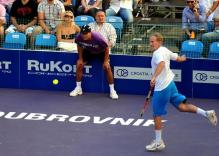 John McEnroe hits a backhand in a match vs Goran Ivanisevic 2010.JPG