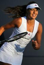 Ana Ivanovic in a white Adidas tennis dress and Adidas visor.JPG