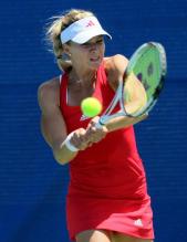 Maria Kirilenko hits a chest-high 2 handed backhand.JPG