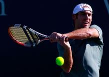 Robby Ginepri 2 handed backhand follow through.JPG
