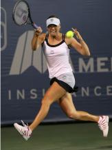 Vera Zvonareva hits a running topspin forehand.JPG
