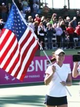 Ashley Harkleroad holds the USA flag.jpg