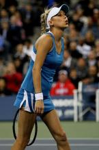 Anna Kournikova makes kissy lips during the 2010 US Open.JPG