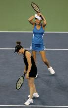 Anna Kournikova can't believe it as Martina Hingis laughs.JPG