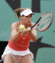 Ashley Harkleroad goes for a two handed backhand.jpg