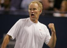 John McEnroe in a Nike shirt does a fist pump celebration.JPG
