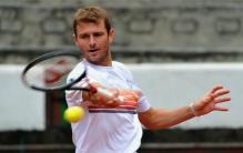 Mardy Fish hits a sweeping forehand.JPG